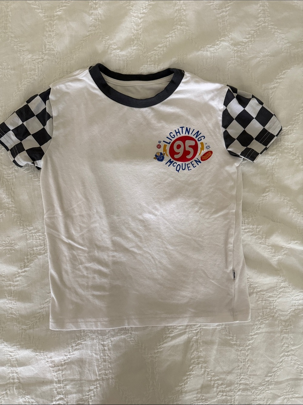 Little Sleepies White Tee with Black Checkered Sleeves and Red Accent